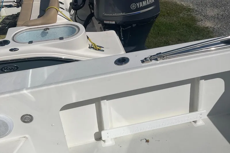 Slide: The Image of 2020 Parker 2530 Extended Sport Cabin boat with Yamaha engine, featuring a clean deck layout. - 9