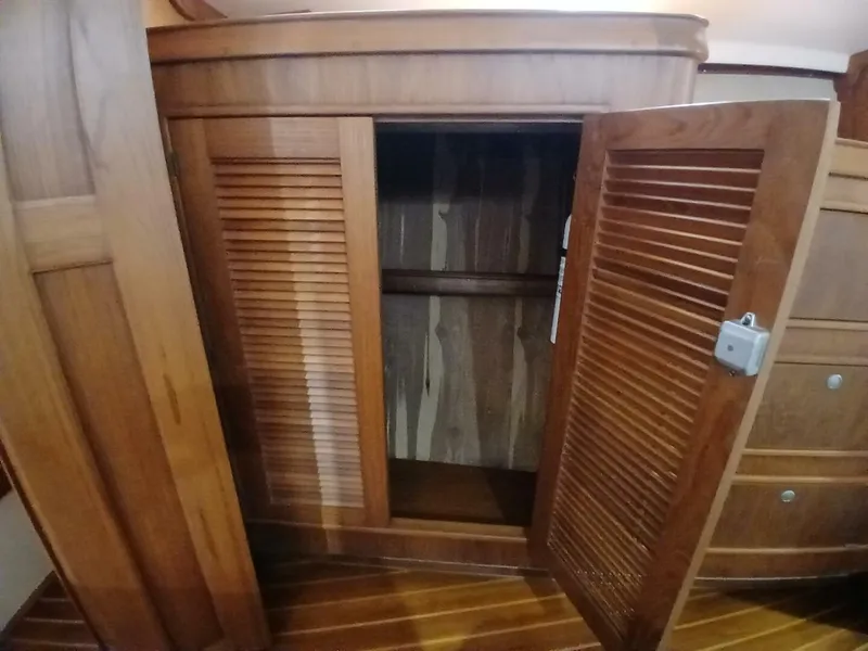 Slide: The Image of Wooden closet interior on a 1999 Island Packet 45 yacht. - 22