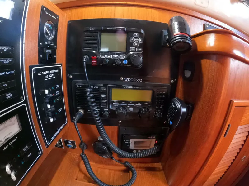 Slide: The Image of Control panel of a 1999 Island Packet 45 sailboat with communication equipment. - 35