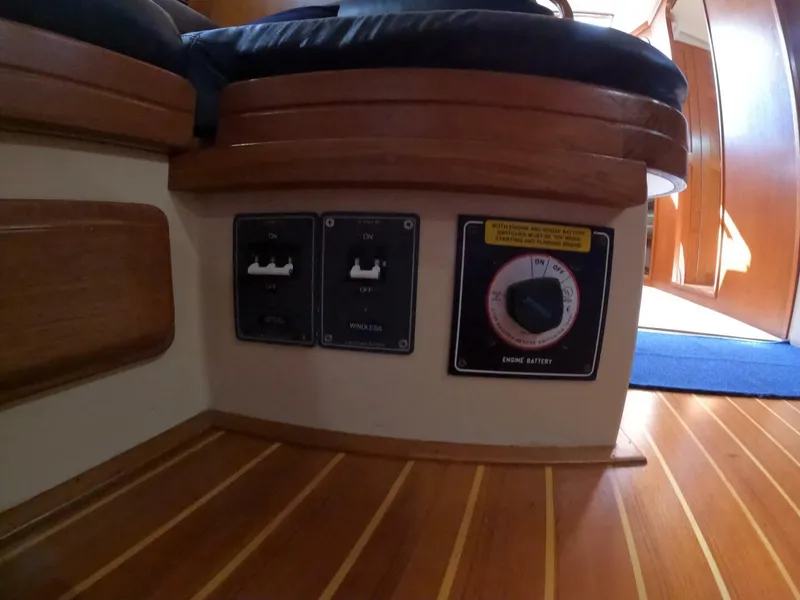 Slide: The Image of Control panel on 1999 Island Packet 45 yacht with switches and engine battery dial. - 41