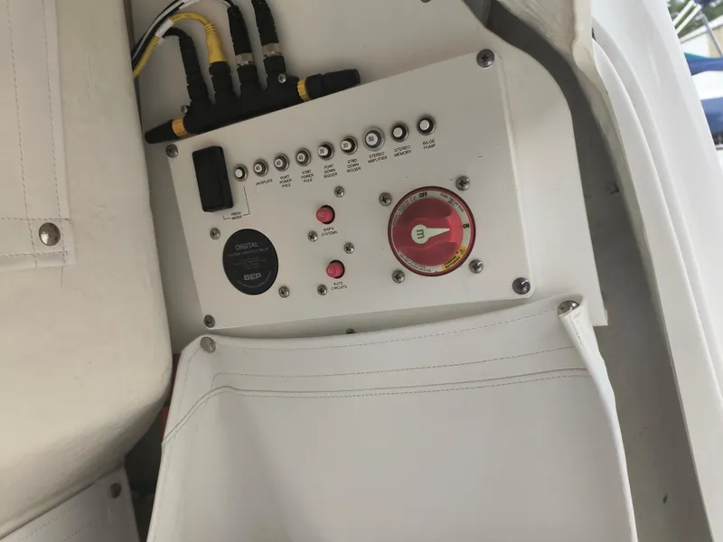 Slide: The Image of Control panel of a 2020 Wellcraft 222 Fisherman boat with switches and wiring. - 13
