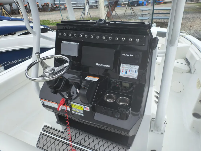 Slide: The Image of 2020 Wellcraft 222 Fisherman boat console with steering wheel and Raymarine electronics. - 14