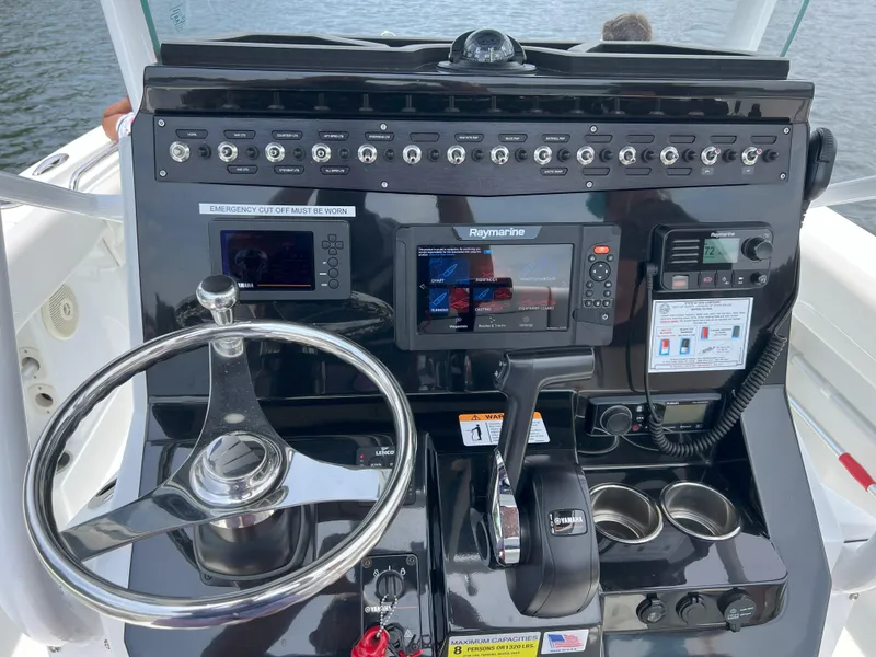 Slide: The Image of Control panel of a 2020 Wellcraft 222 Fisherman boat with navigation equipment. - 15