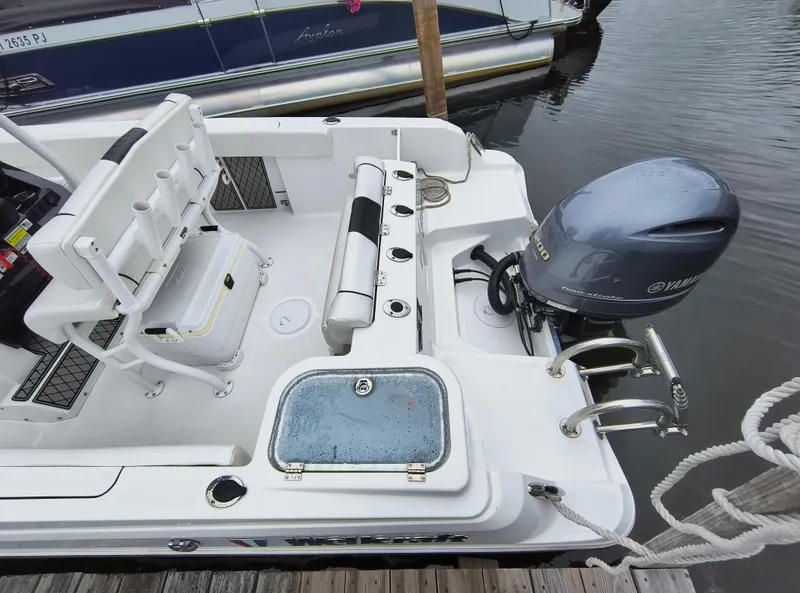 Slide: The Image of 2020 Wellcraft 222 Fisherman boat with Yamaha engine, docked at marina. - 22