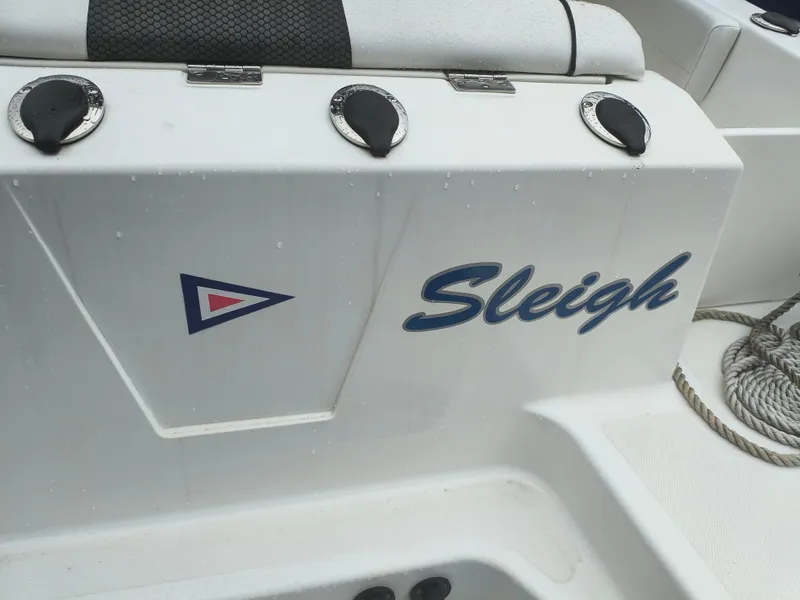 Slide: The Image of 2020 Wellcraft 222 Fisherman boat with "Sleigh" name and nautical emblem. - 26