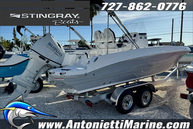 Slide: The Image of 2026 Stingray 206 CC boat with Suzuki engine on trailer at Antonietti Marine. - 1