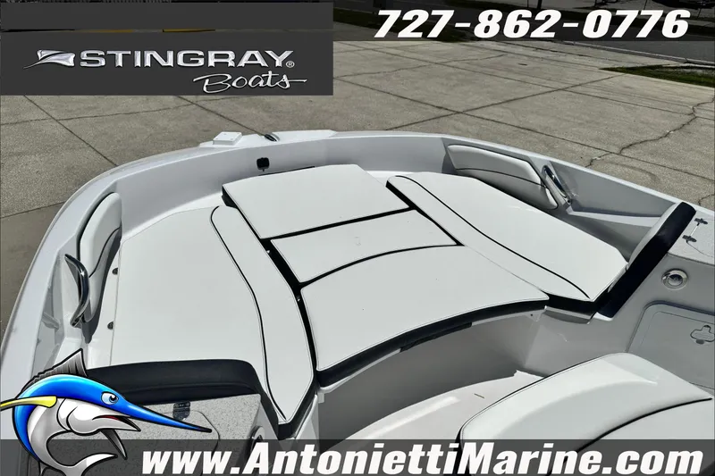 Slide: The Image of 2026 Stingray 206 CC boat interior with white seating, displayed by Antonietti Marine. - 11