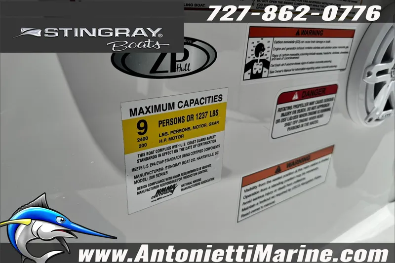 Slide: The Image of Stingray 206 CC boat capacity and safety labels with contact information for Antonietti Marine. - 12