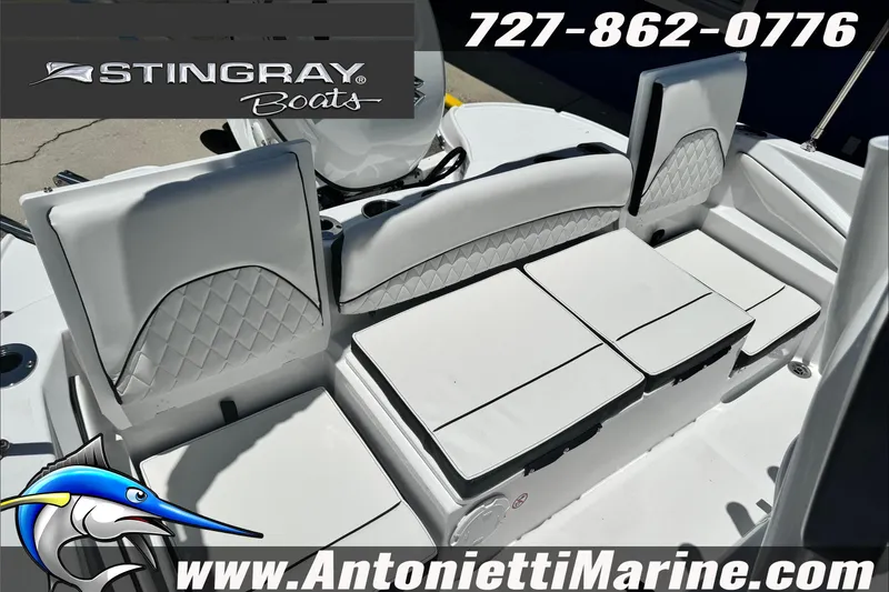 Slide: The Image of 2026 Stingray 206 CC boat interior with white seating, displayed by Antonietti Marine. - 13
