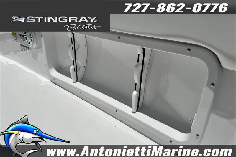 Slide: The Image of 2026 Stingray 206 CC boat interior detail with logo and contact information. - 17