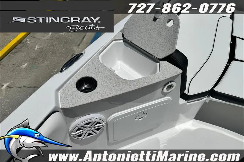 Slide: The Image of 2026 Stingray 206 CC boat interior with storage compartment and speaker, Antonietti Marine branding. - 18