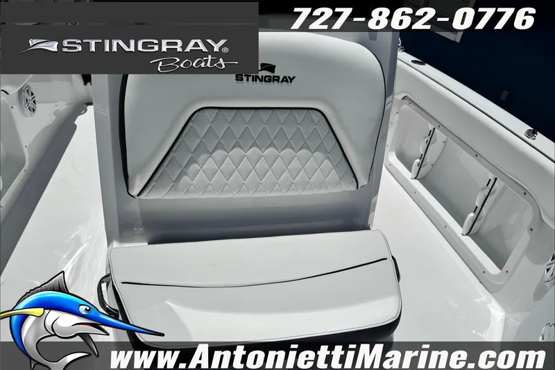 Slide: The Image of Stingray 206 CC boat seat with diamond pattern upholstery, featuring logo and contact details. - 19