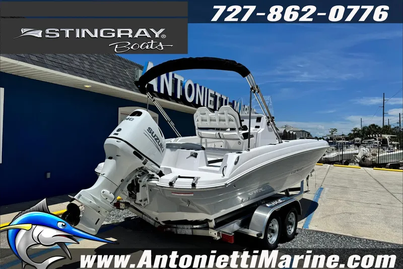 Slide: The Image of 2026 Stingray 206 CC boat with Suzuki engine at Antonietti Marine dealership. - 2