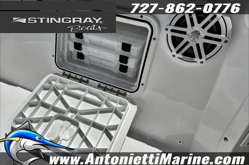 Slide: The Image of 2026 Stingray 206 CC boat storage compartment and speaker, Antonietti Marine branding. - 21