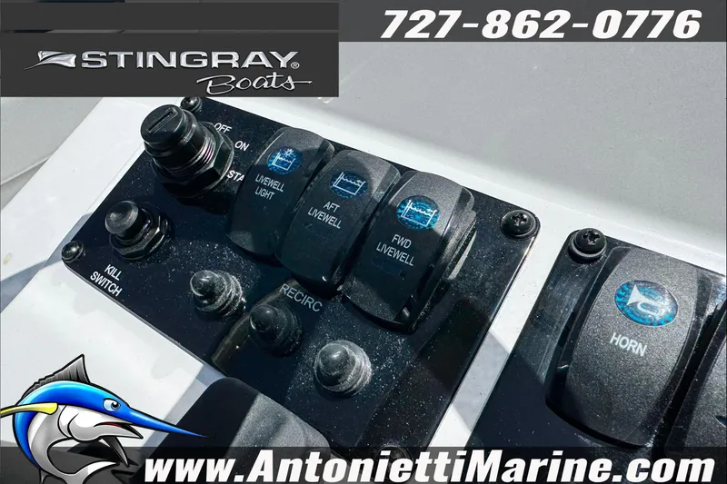 Slide: The Image of Control panel of 2026 Stingray 206 CC boat with switches and logo. - 26