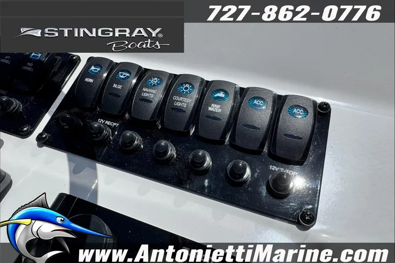 Slide: The Image of Control panel of 2026 Stingray 206 CC boat with various switches and logo. - 27