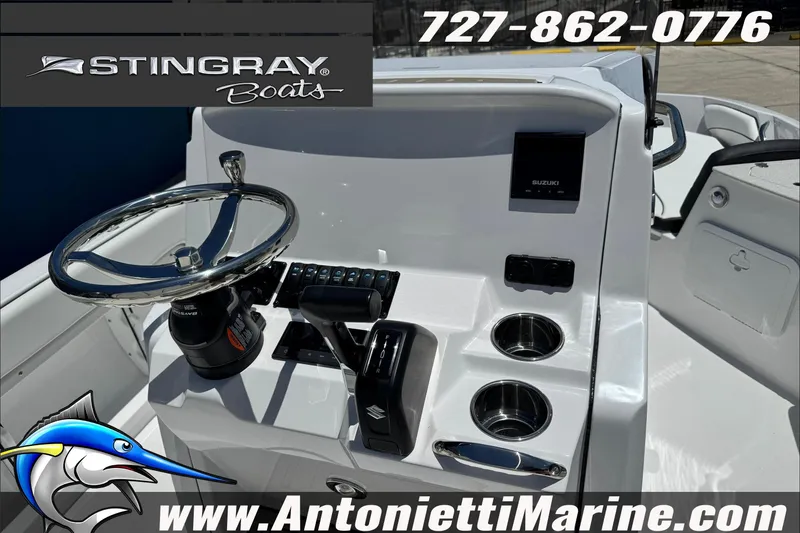 Slide: The Image of 2026 Stingray 206 CC boat dashboard with steering wheel and controls, Antonietti Marine branding. - 28