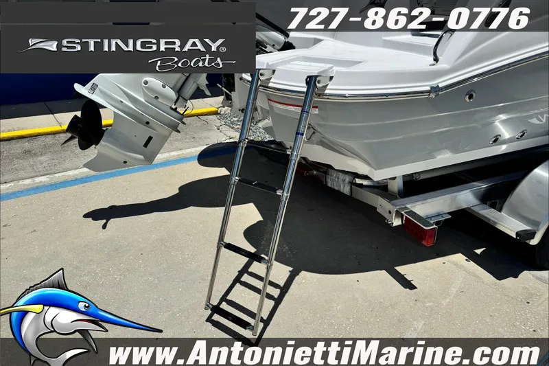 Slide: The Image of 2026 Stingray 206 CC boat with ladder and outboard motor at Antonietti Marine. - 30