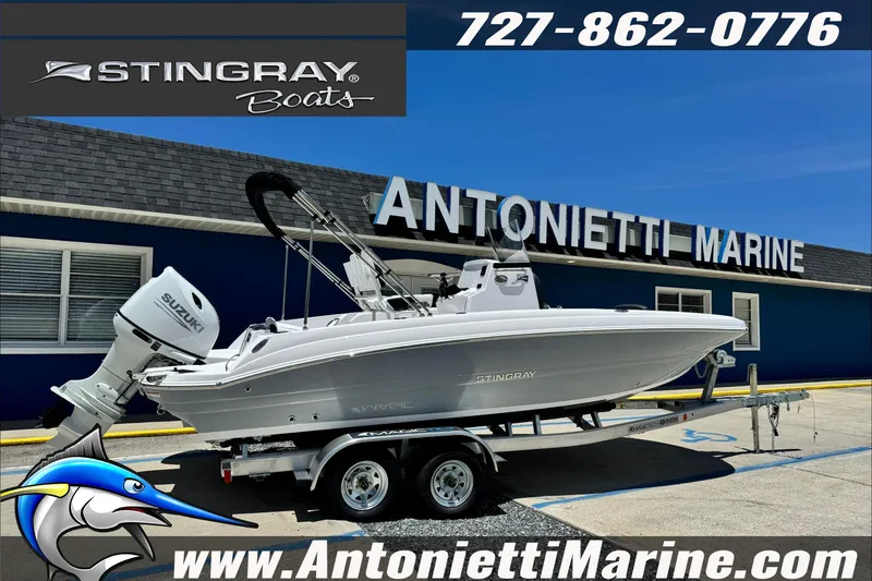 Slide: The Image of 2026 Stingray 206 CC boat on trailer at Antonietti Marine dealership. - 31