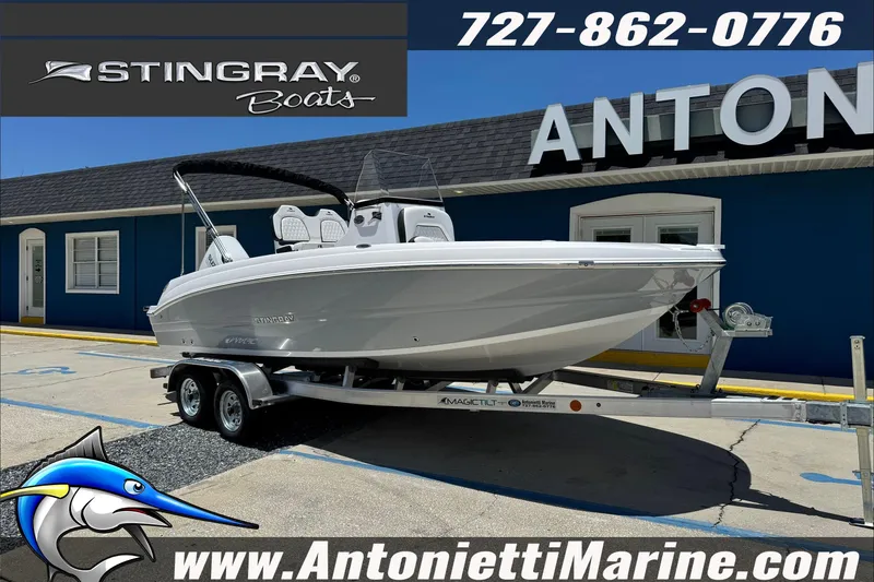 Slide: The Image of 2026 Stingray 206 CC boat on trailer at Antonietti Marine dealership. - 32