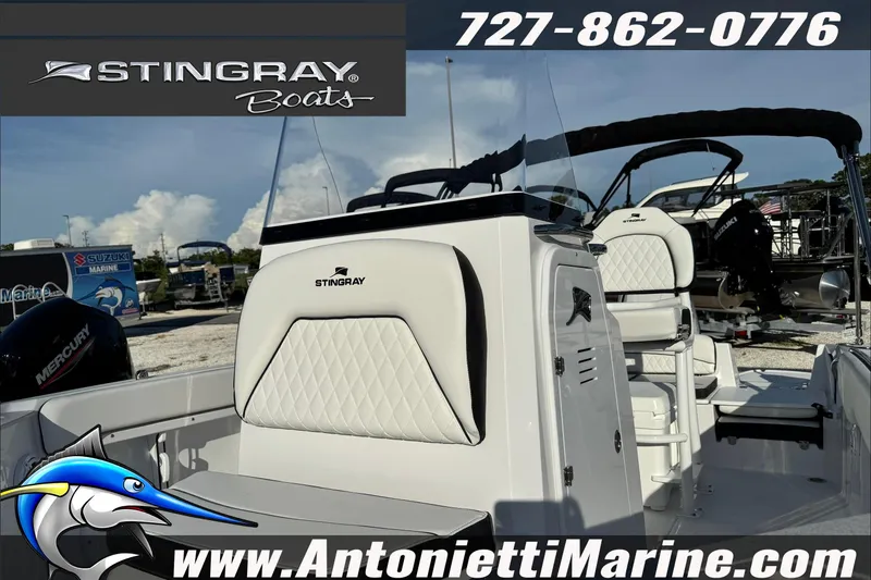 Slide: The Image of 2026 Stingray 206 CC boat interior with white seating, displayed at Antonietti Marine. - 34