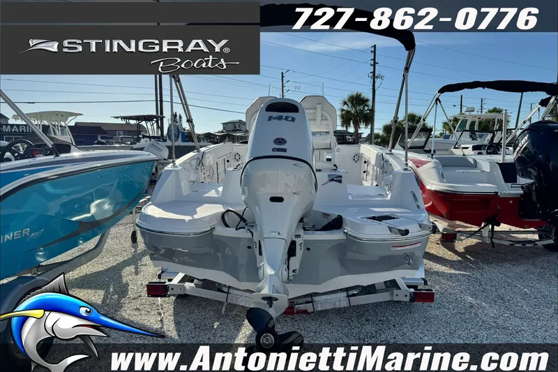 Slide: The Image of 2026 Stingray 206 CC boat displayed at Antonietti Marine dealership. - 38