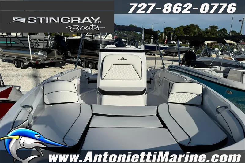 Slide: The Image of 2026 Stingray 206 CC boat interior with seating, displayed at Antonietti Marine dealership. - 39