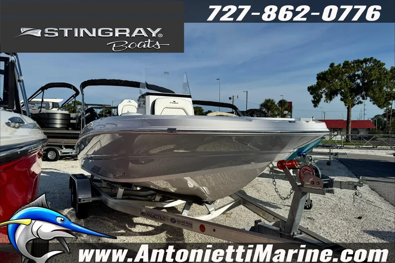 Slide: The Image of 2026 Stingray 206 CC boat on trailer at Antonietti Marine dealership. - 40
