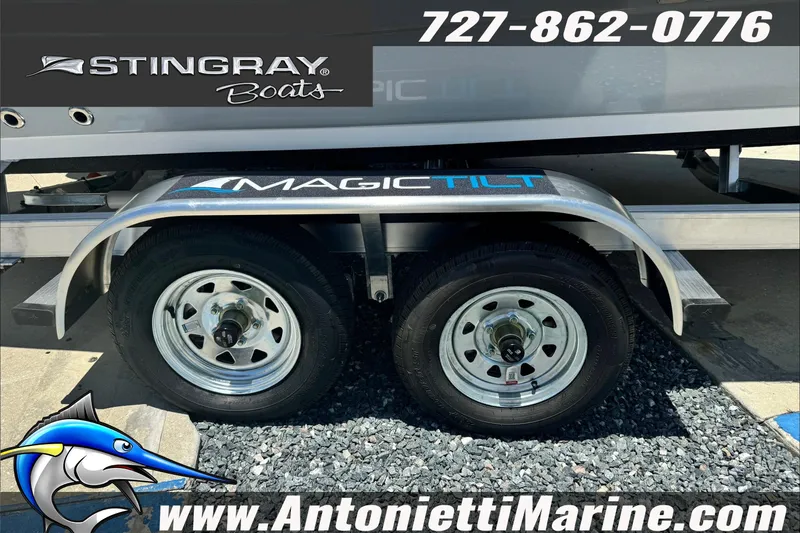 Slide: The Image of Trailer with dual wheels for 2026 Stingray 206 CC boat, featuring Magic Tilt branding. - 5