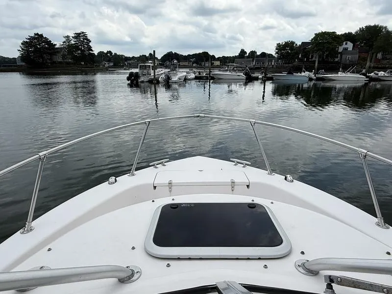 Slide: The Image of Bow view of 2003 Grady-White 226 Sea Farer in a calm marina. - 11