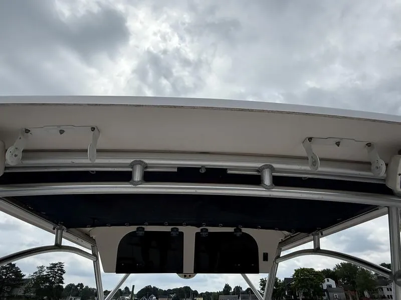 Slide: The Image of 2003 Grady-White 226 Sea Farer boat canopy under cloudy sky. - 12