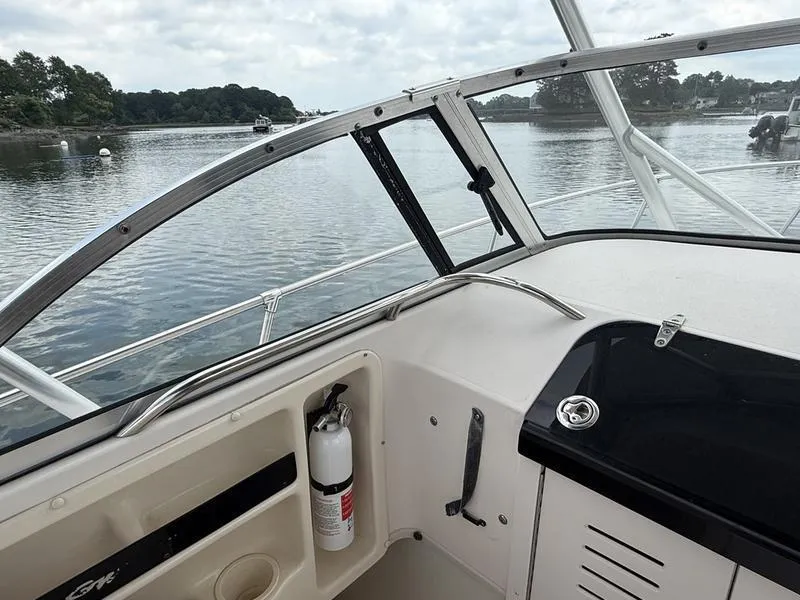 Slide: The Image of 2003 Grady-White 226 Sea Farer boat interior with water view and safety equipment. - 13