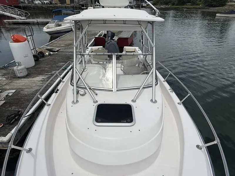 Slide: The Image of 2003 Grady-White 226 Sea Farer boat docked at marina, view from bow. - 4