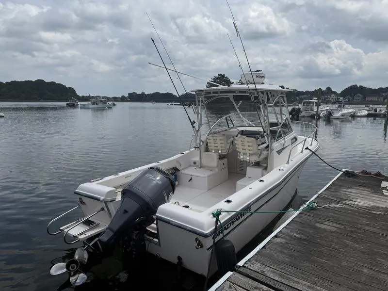 Slide: The Image of 2003 Grady-White 226 Sea Farer boat docked on a cloudy day. - 5