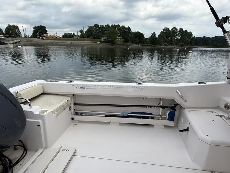 Slide: The Image of 2003 Grady-White 226 Sea Farer boat interior with calm water and cloudy sky. - 6
