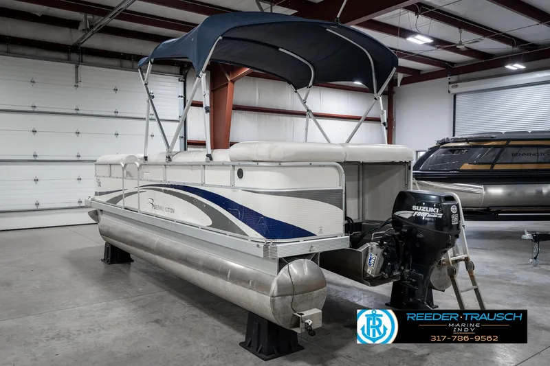 Slide: The Image of 2007 Bennington 2050 GL pontoon boat with Suzuki outboard motor in a showroom. - 10