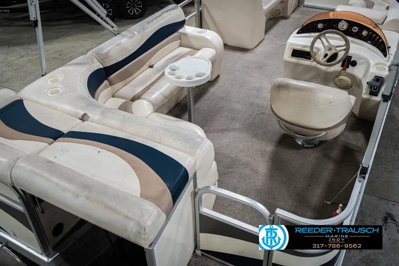 Slide: The Image of Interior of a 2007 Bennington 2050 GL pontoon boat with seating and steering console. - 14