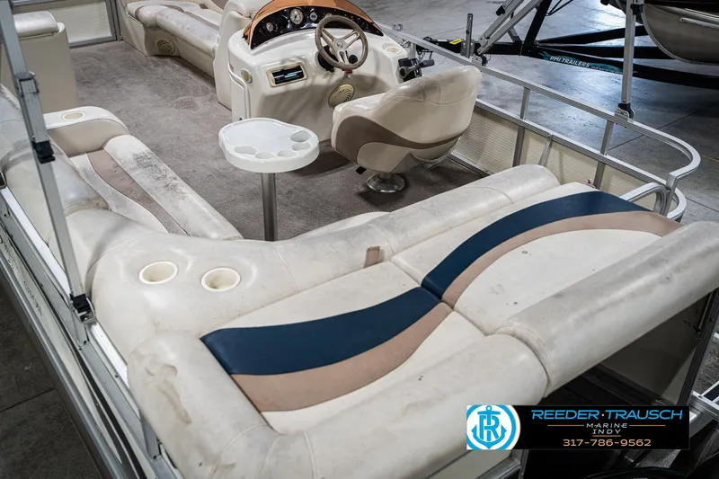 Slide: The Image of 2007 Bennington 2050 GL pontoon boat interior with beige seating and steering console. - 15