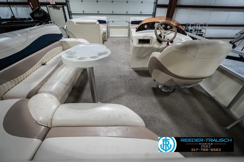 Slide: The Image of 2007 Bennington 2050 GL boat interior with beige seating and steering wheel. - 19