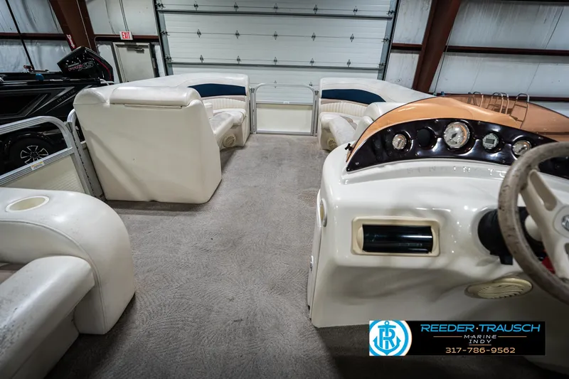 Slide: The Image of Interior of a 2007 Bennington 2050 GL boat with white seating and control panel. - 20