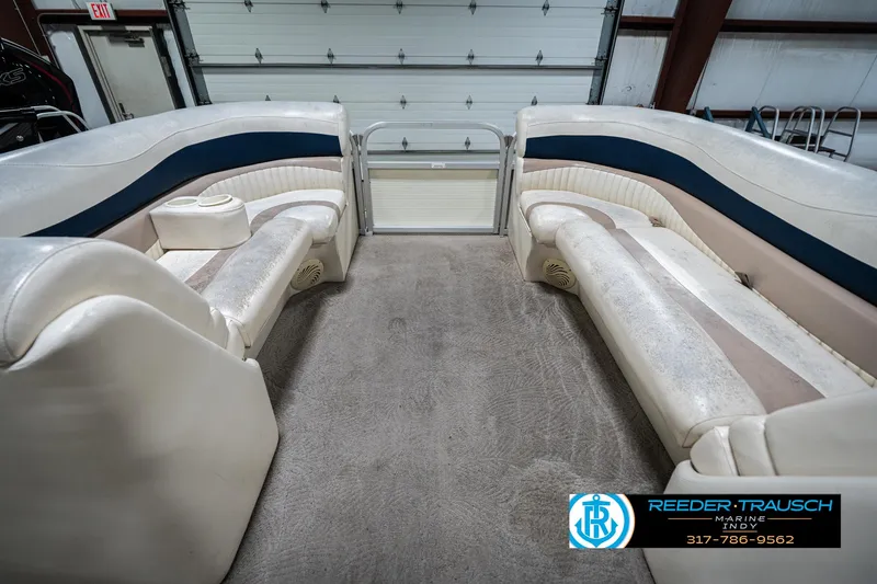 Slide: The Image of 2007 Bennington 2050 GL pontoon boat interior with plush seating and carpeted floor. - 21