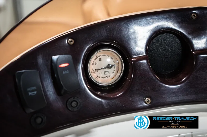 Slide: The Image of Dashboard of a 2007 Bennington 2050 GL boat with gauges and switches. - 35