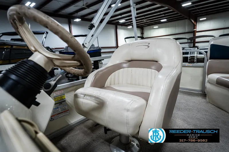 Slide: The Image of 2007 Bennington 2050 GL boat interior with steering wheel and captain's chair. - 39