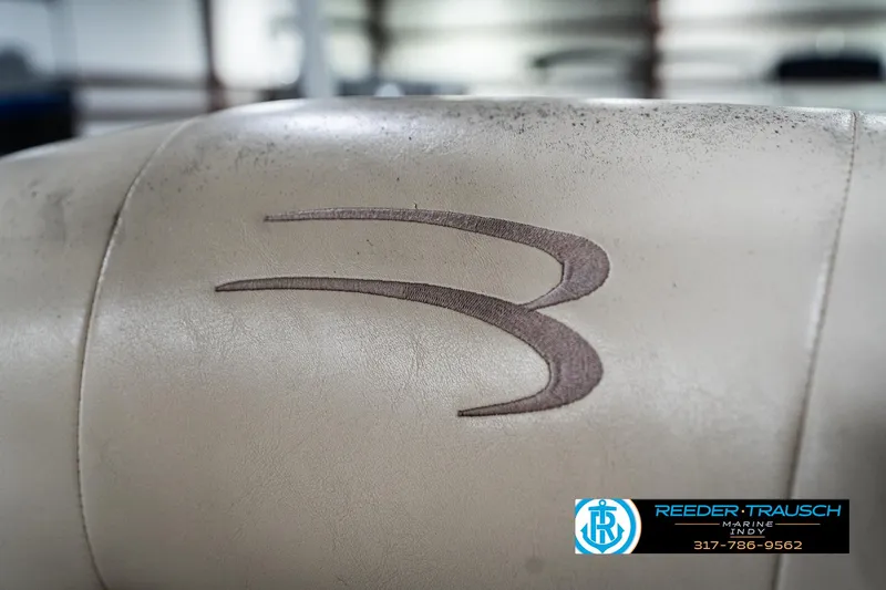 Slide: The Image of 2007 Bennington 2050 GL boat seat with embroidered logo, Reeder-Trausch Marine contact details. - 40