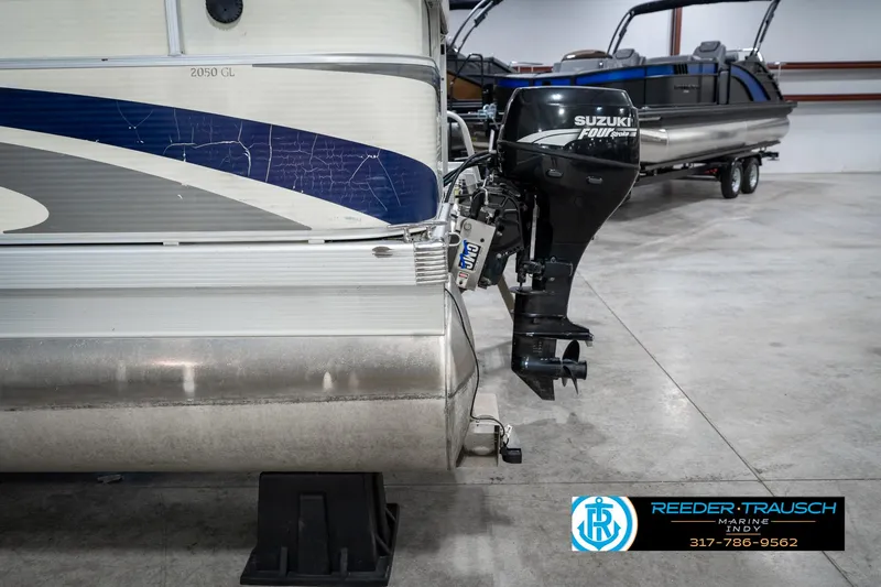 Slide: The Image of 2007 Bennington 2050 GL pontoon boat with Suzuki outboard motor in showroom. - 44