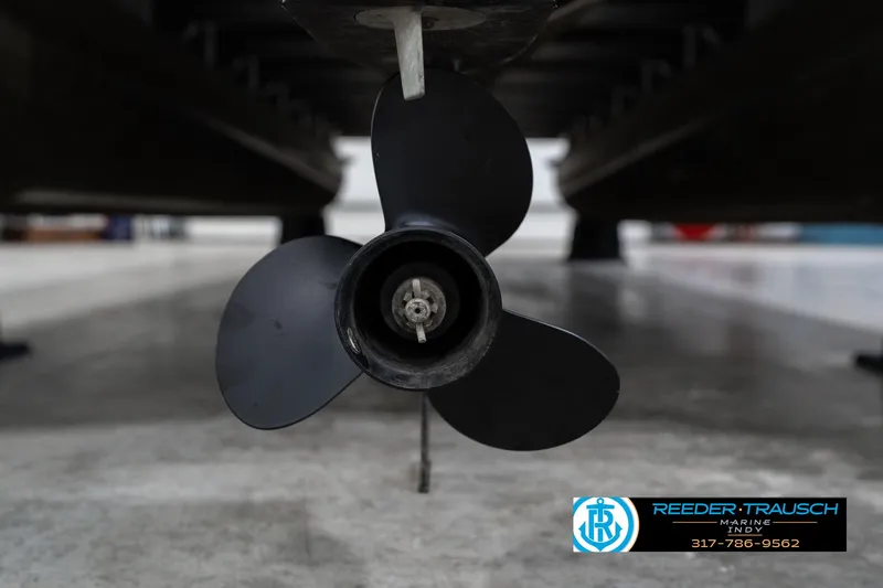 Slide: The Image of Propeller of 2007 Bennington 2050 GL boat in a showroom setting. - 47
