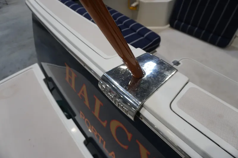 Slide: The Image of 2006 Back Cove 29 boat detail with polished metal and wood accents. - 11
