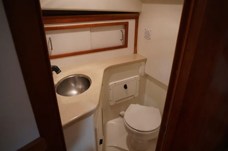 Slide: The Image of 2006 Back Cove 29 boat bathroom with sink and toilet. - 18