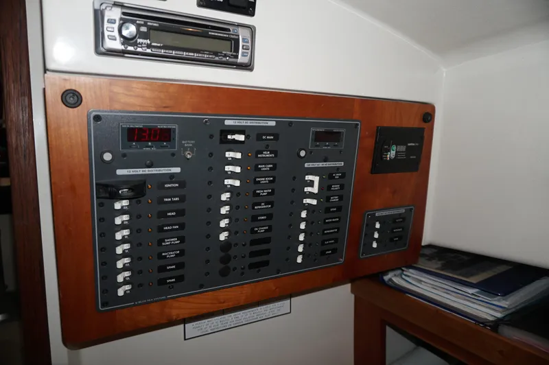 Slide: The Image of Electrical panel of a 2006 Back Cove 29 boat, featuring various switches and controls. - 19