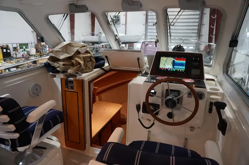 Slide: The Image of 2006 Back Cove 29 boat interior with navigation equipment and seating. - 24